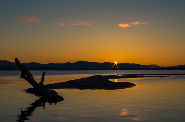 The sun coming up across Lake Champlain